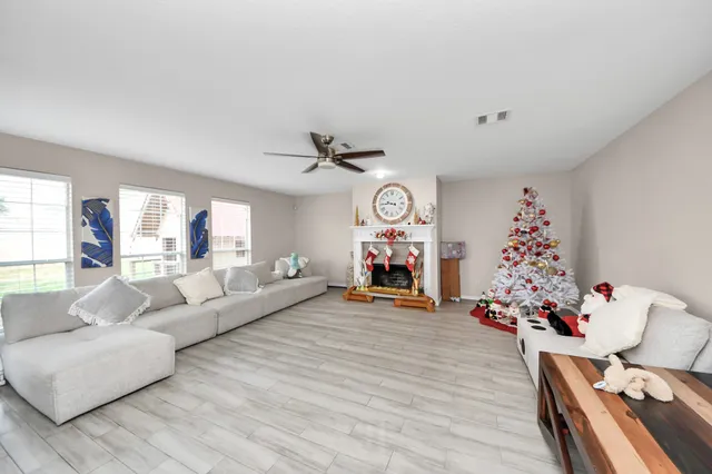 a living room with furniture and a fireplace
