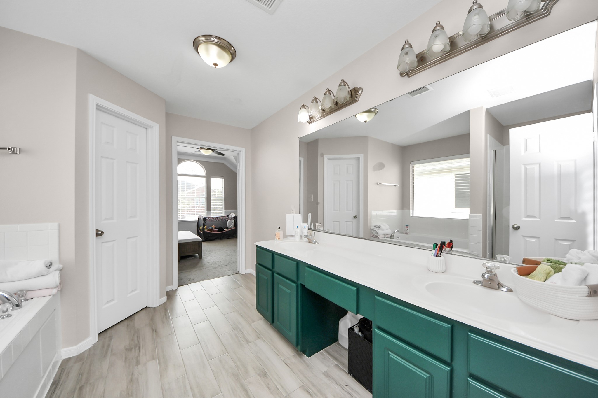515 Spindle Ridge Drive Spring, TX 77386 - Photo 42 of 47 a bathroom with a double vanity sink and a mirror