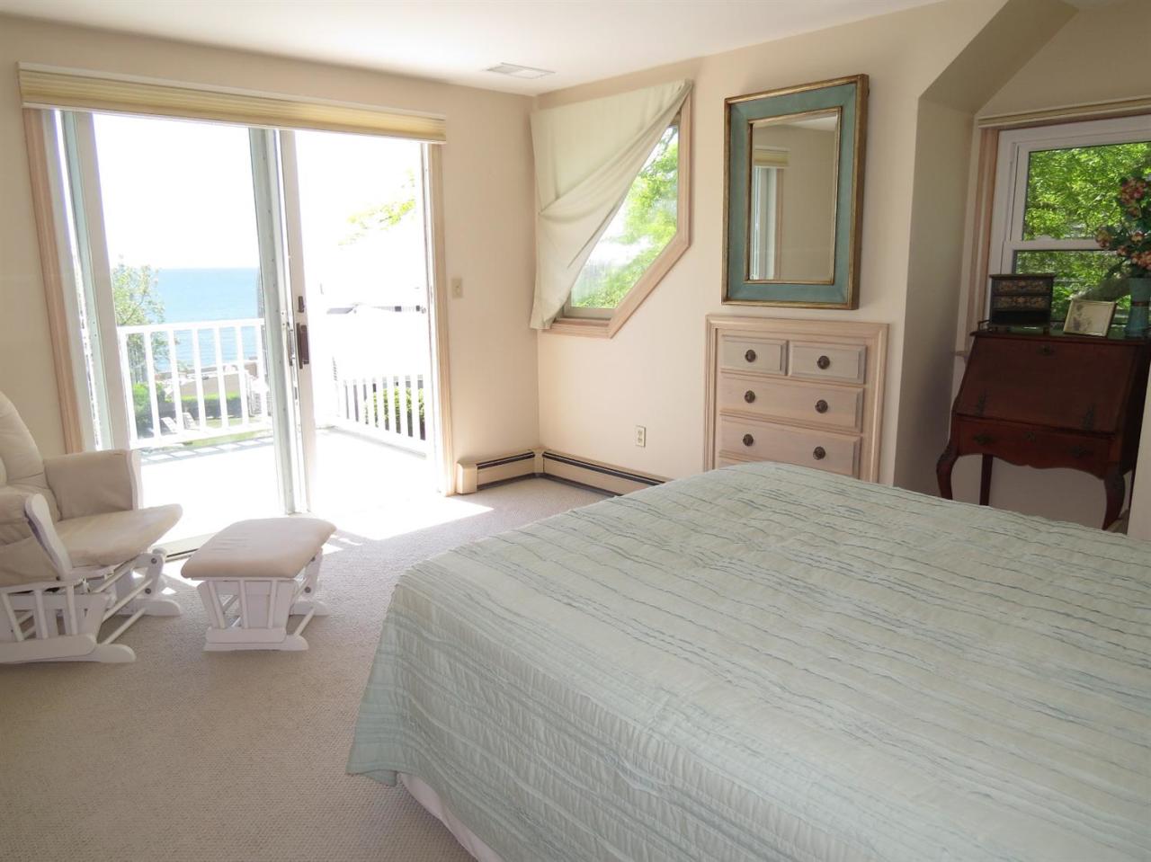 40 Wadsworth Road Chatham, MA 02659 - Photo 12 of 25 a bedroom with a bed and a large window