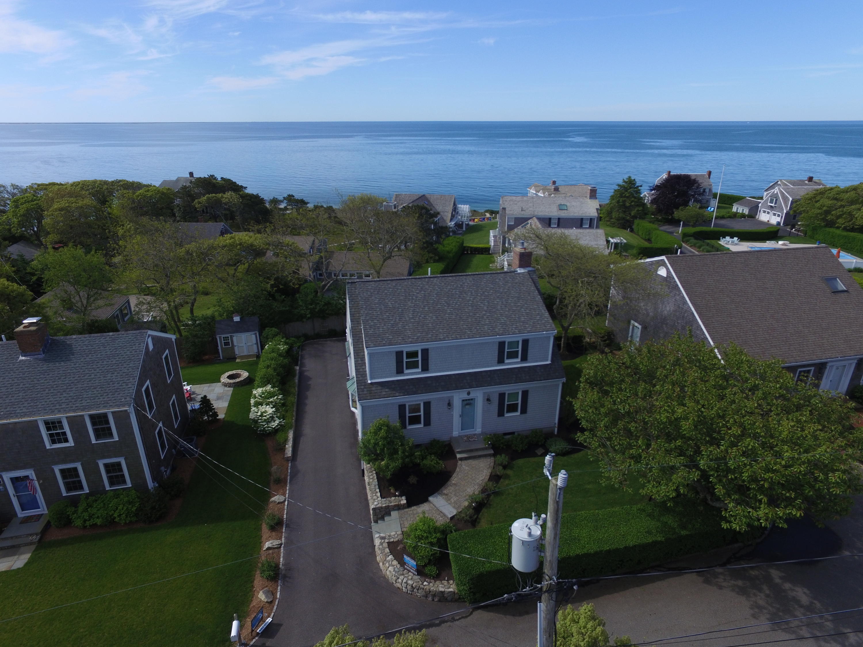 40 Wadsworth Road Chatham, MA 02659 - Photo 2 of 25 an aerial view of multiple houses with a yard