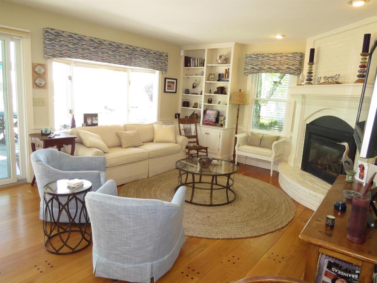 40 Wadsworth Road Chatham, MA 02659 - Photo 4 of 25 a living room with furniture and a fireplace