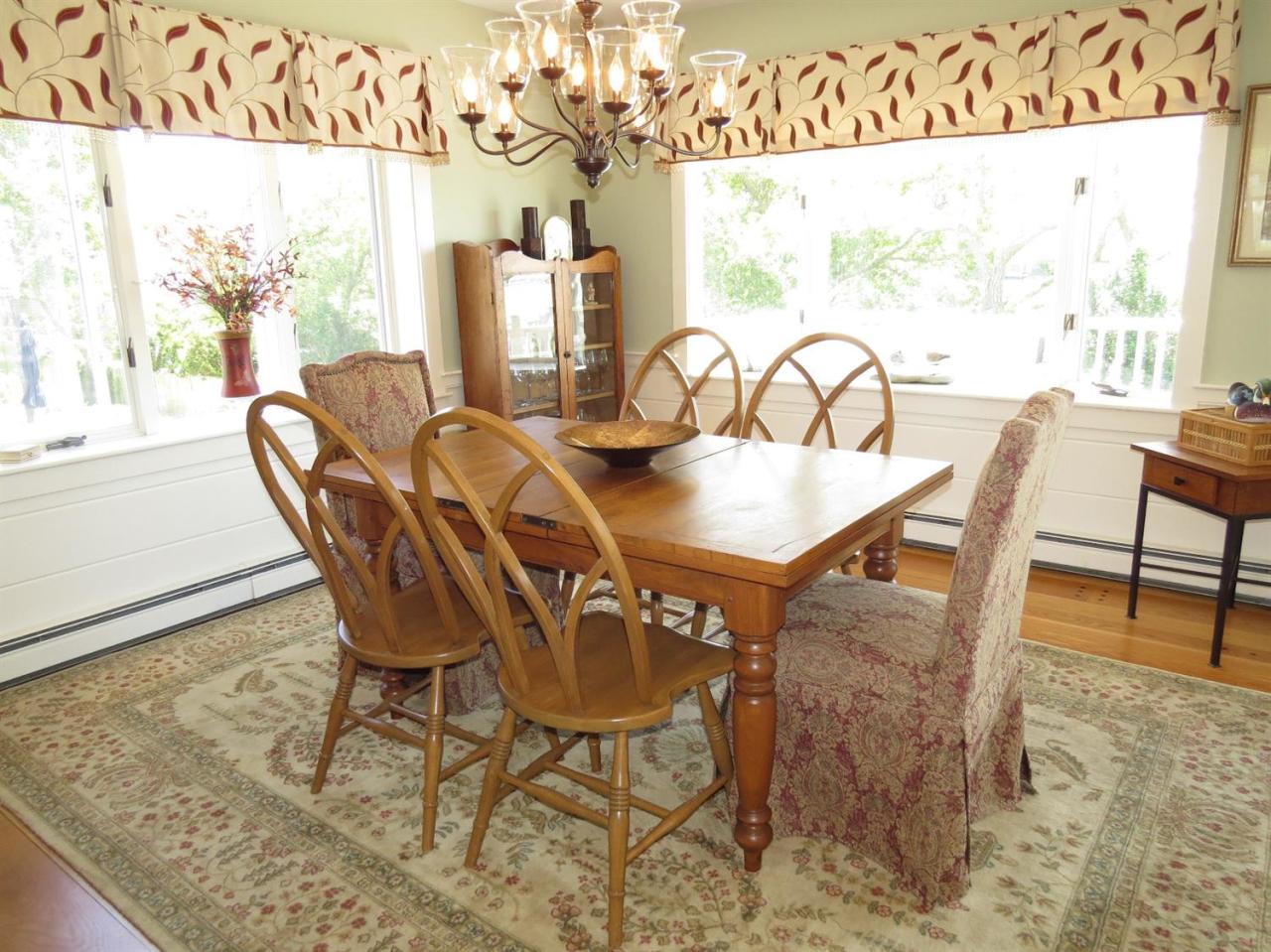40 Wadsworth Road Chatham, MA 02659 - Photo 7 of 25 a view of a dining room with furniture and wooden floor