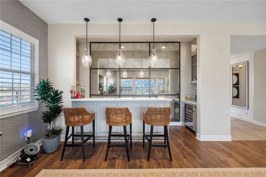 11463 Explorer Court Temescal Valley, CA 92883 - Photo 15 of 59 a dinning table and chairs in a room