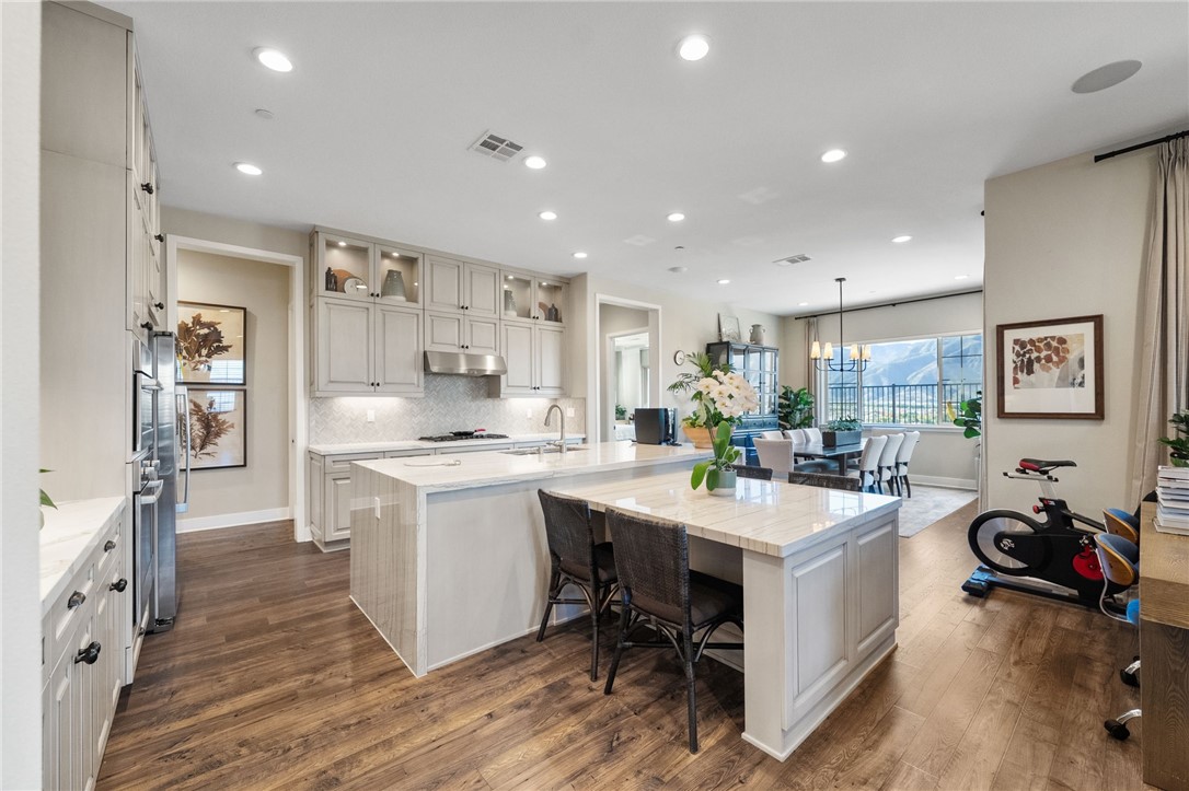 11463 Explorer Court Temescal Valley, CA 92883 - Photo 19 of 59 a kitchen with a sink appliances and cabinets