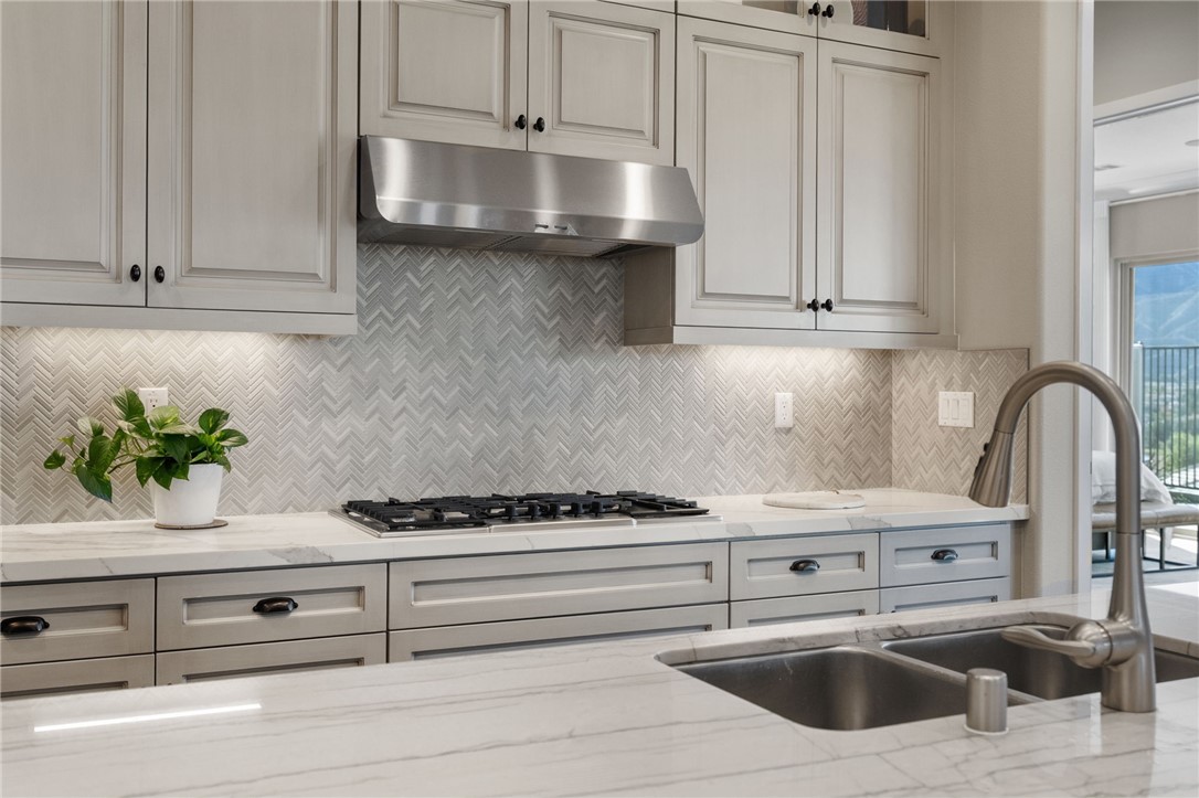 11463 Explorer Court Temescal Valley, CA 92883 - Photo 20 of 59 a kitchen with granite countertop a sink stainless steel appliances and cabinets