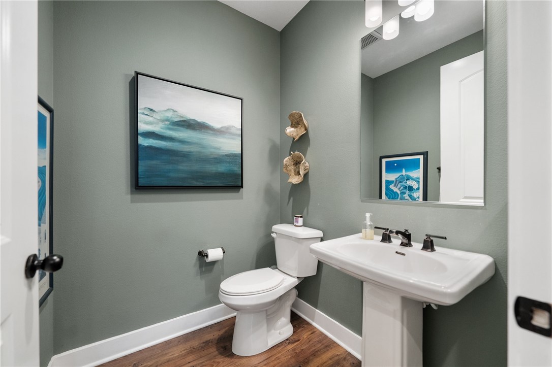 11463 Explorer Court Temescal Valley, CA 92883 - Photo 29 of 59 a bathroom with a toilet sink and mirror