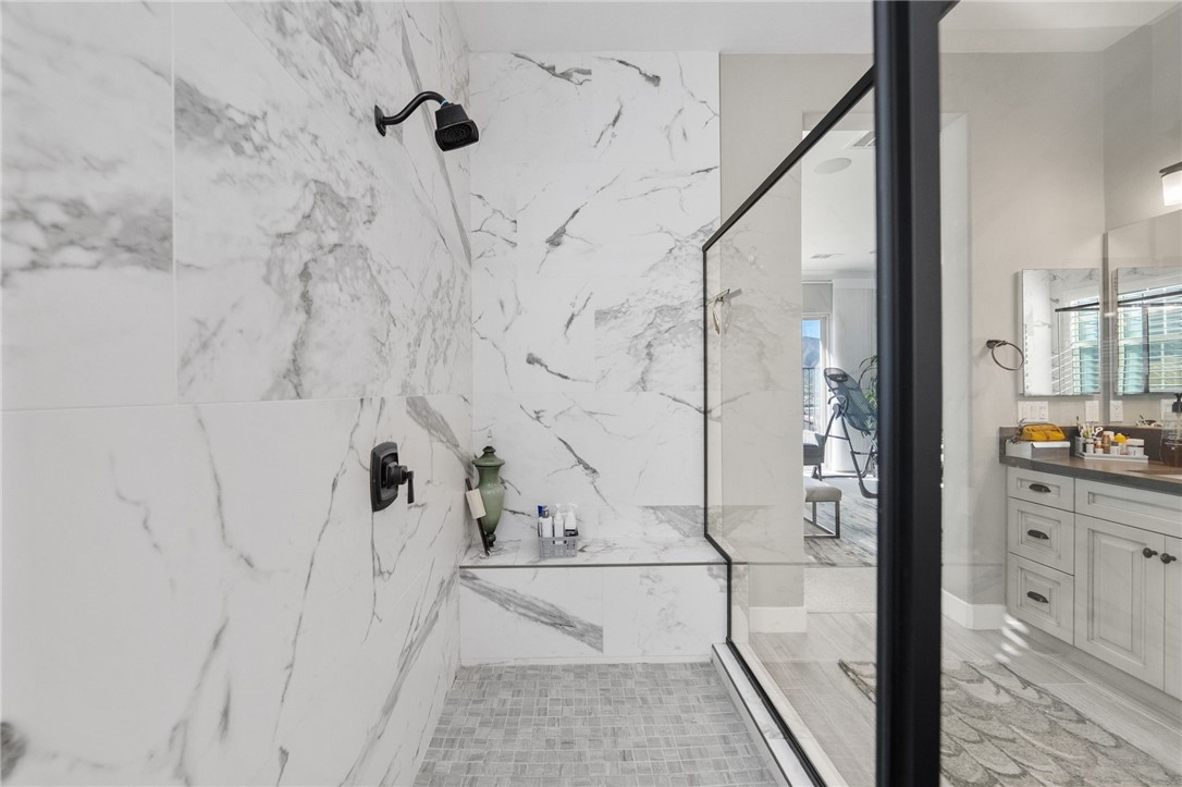 11463 Explorer Court Temescal Valley, CA 92883 - Photo 34 of 59 a bathroom with a bathtub and shower