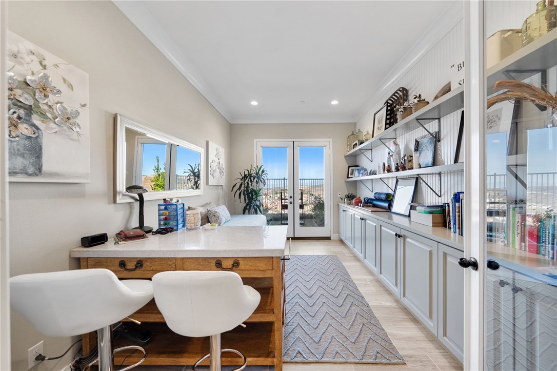 11463 Explorer Court Temescal Valley, CA 92883 - Photo 36 of 59 a dining room with furniture and a kitchen