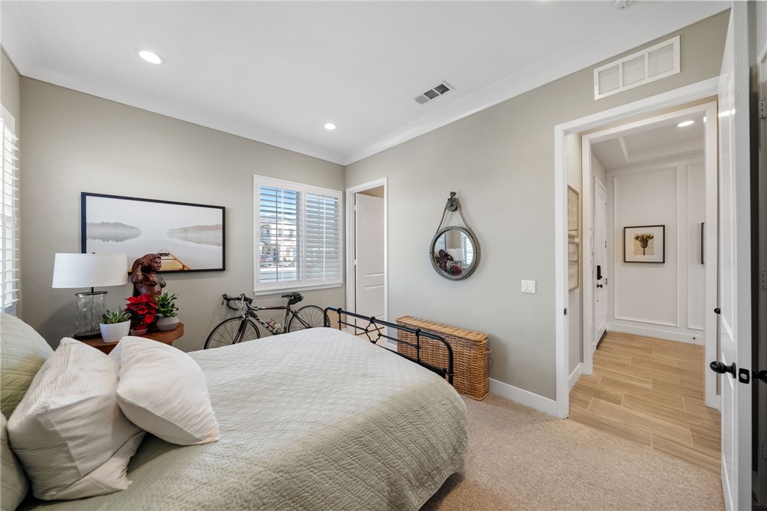 11463 Explorer Court Temescal Valley, CA 92883 - Photo 39 of 59 a bed room with two bed and a large mirror