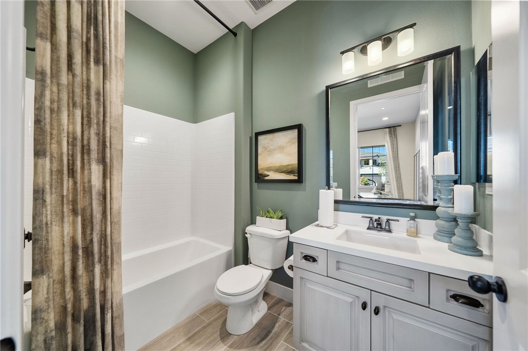 11463 Explorer Court Temescal Valley, CA 92883 - Photo 43 of 59 a bathroom with a sink a toilet and shower