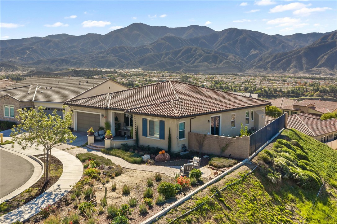 11463 Explorer Court Temescal Valley, CA 92883 - Photo 5 of 59 a view of a house with a yard and mountain view