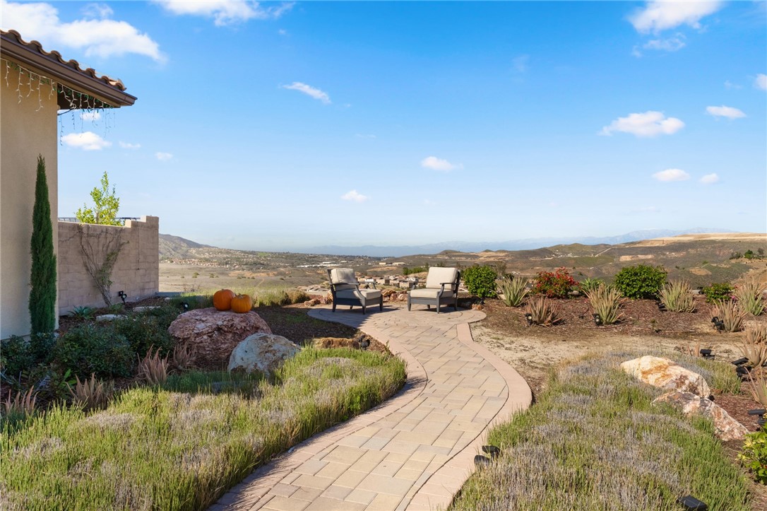 11463 Explorer Court Temescal Valley, CA 92883 - Photo 6 of 59 a view of a lake with couches and city view