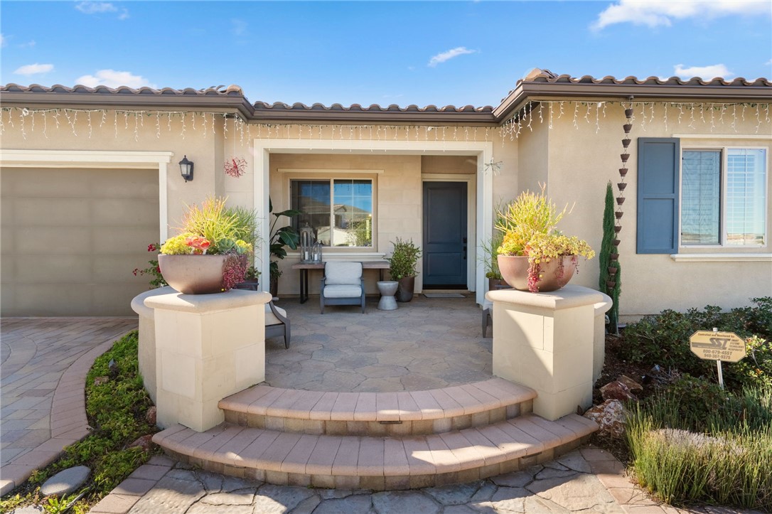 11463 Explorer Court Temescal Valley, CA 92883 - Photo 9 of 59 a view of a house with fountain in backyard