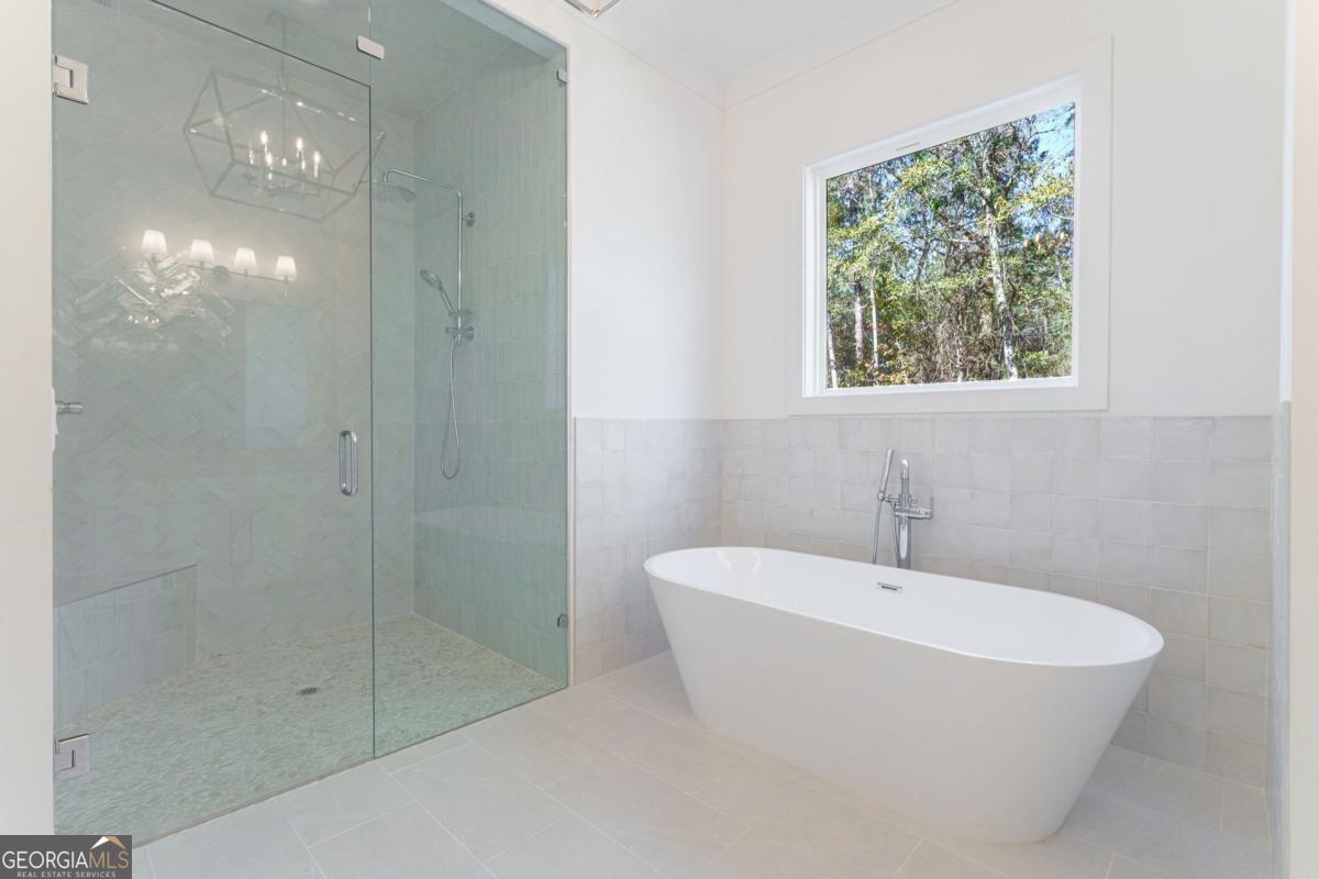 140 Parkside Lane Eatonton, GA 31024 - Photo 17 of 37 a white bath tub sitting next to a shower