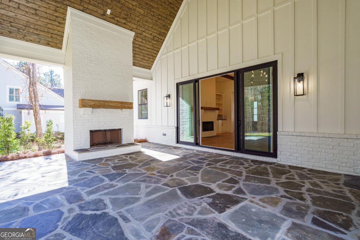 140 Parkside Lane Eatonton, GA 31024 - Photo 31 of 37 a view of empty room with a fireplace and windows