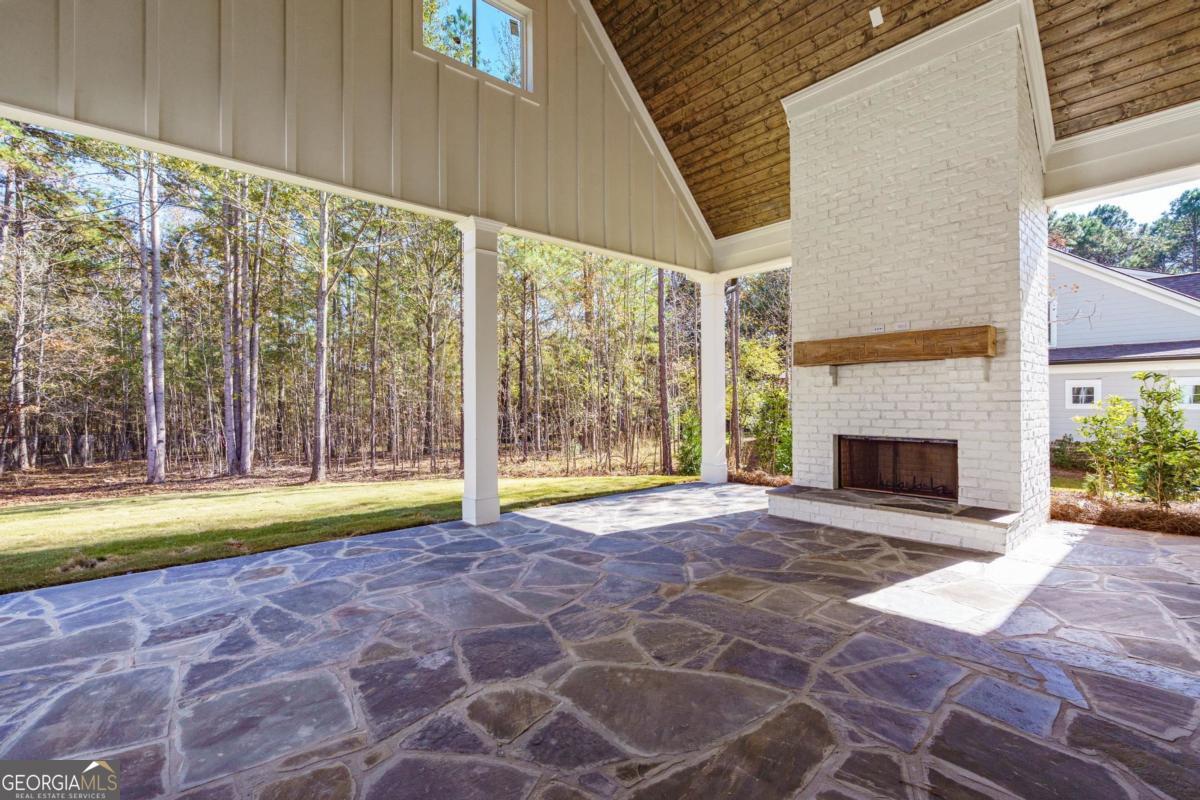 140 Parkside Lane Eatonton, GA 31024 - Photo 32 of 37 a view of empty room with floor to ceiling window and yard
