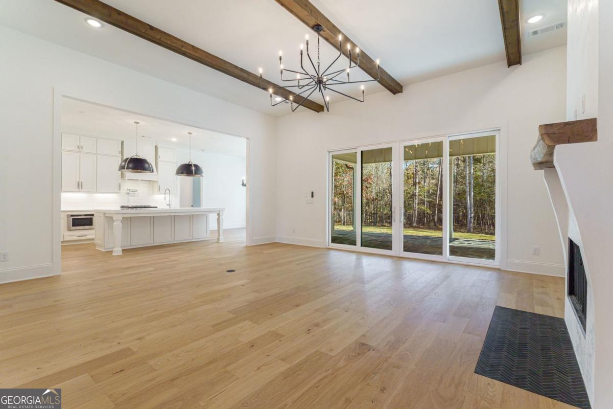 140 Parkside Lane Eatonton, GA 31024 - Photo 8 of 37 a view of an empty room with a window