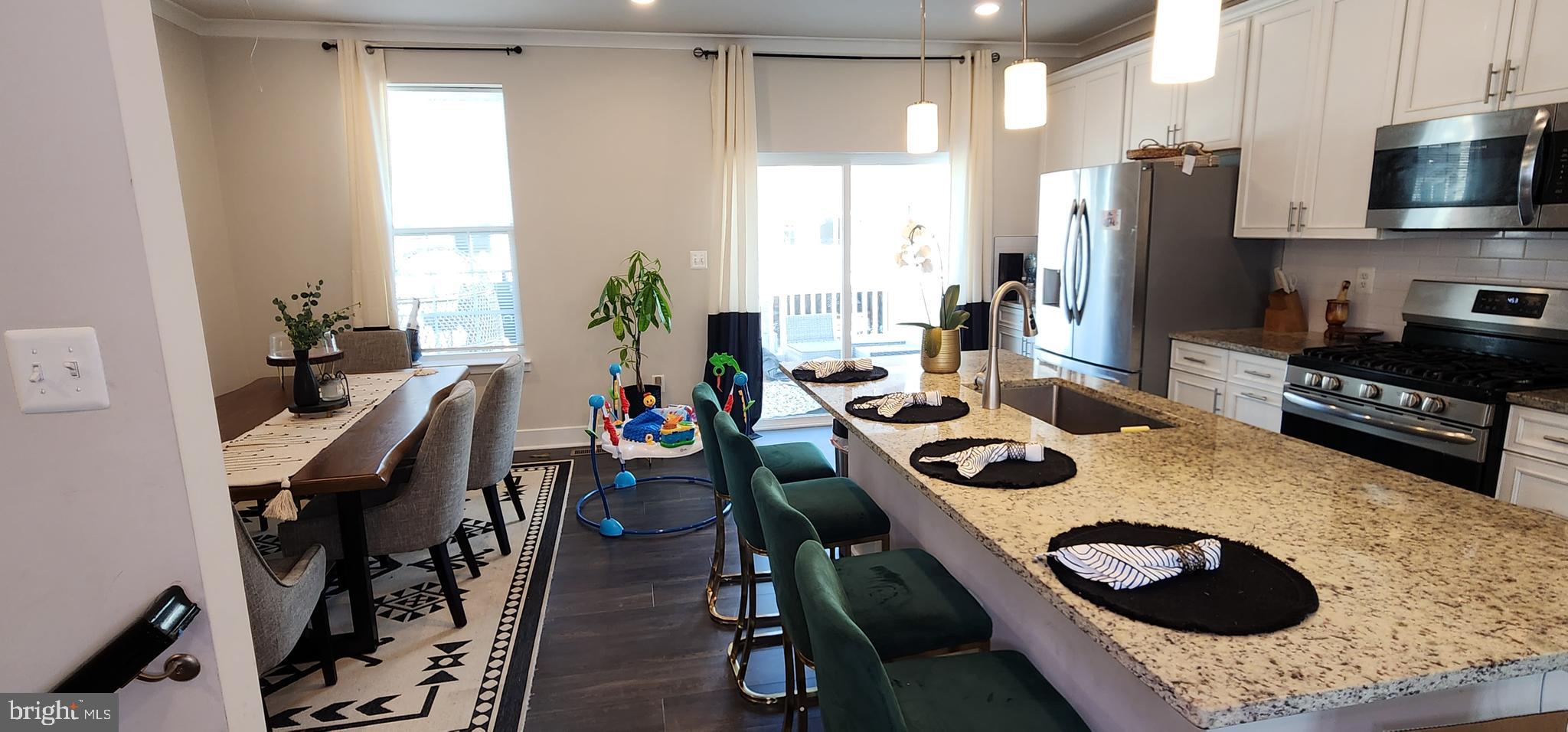 2 2nd, Unit 201 Lewes, DE 19958 - Photo 11 of 48 a kitchen with a sink a stove and a refrigerator