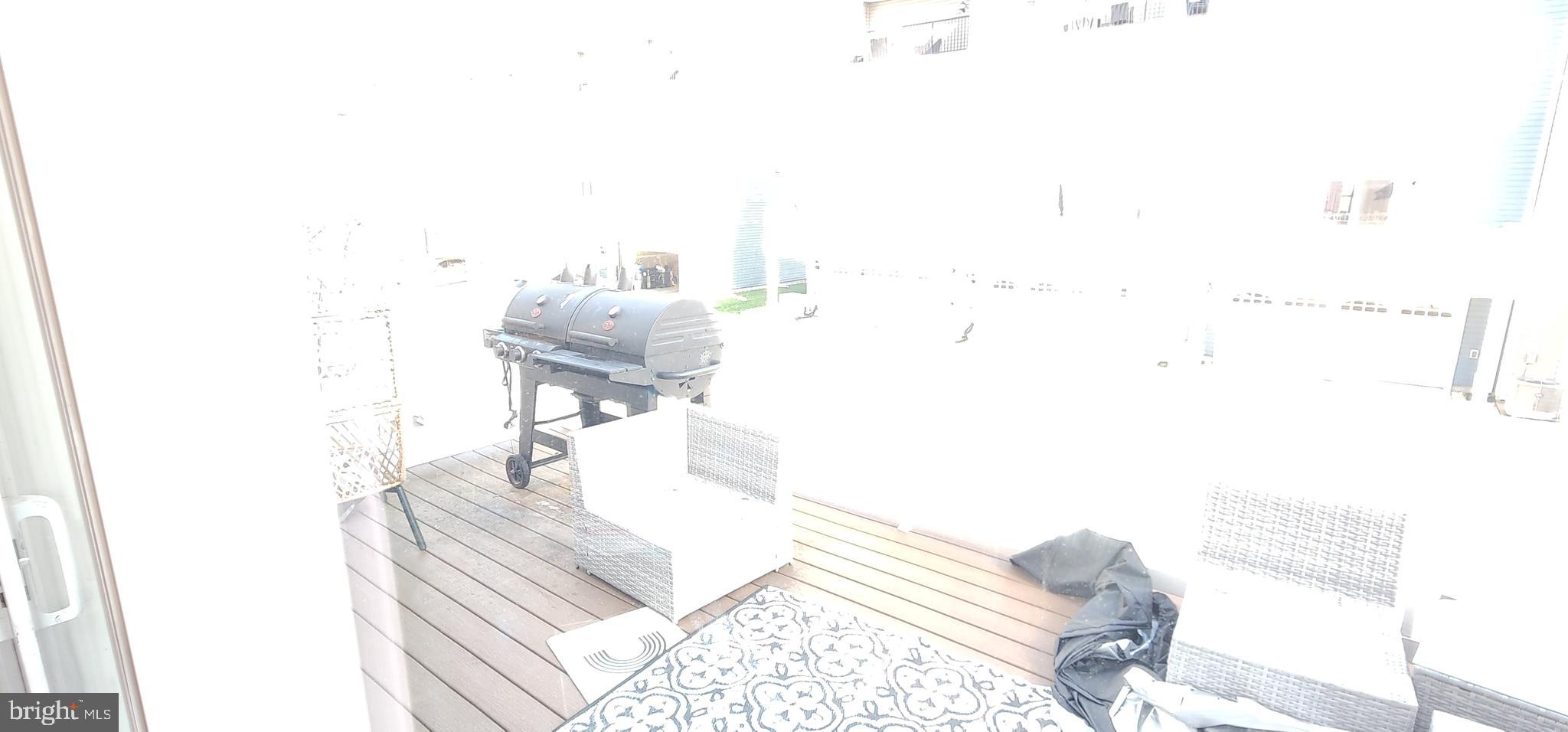 2 2nd, Unit 201 Lewes, DE 19958 - Photo 17 of 48 a living room with furniture and a rug