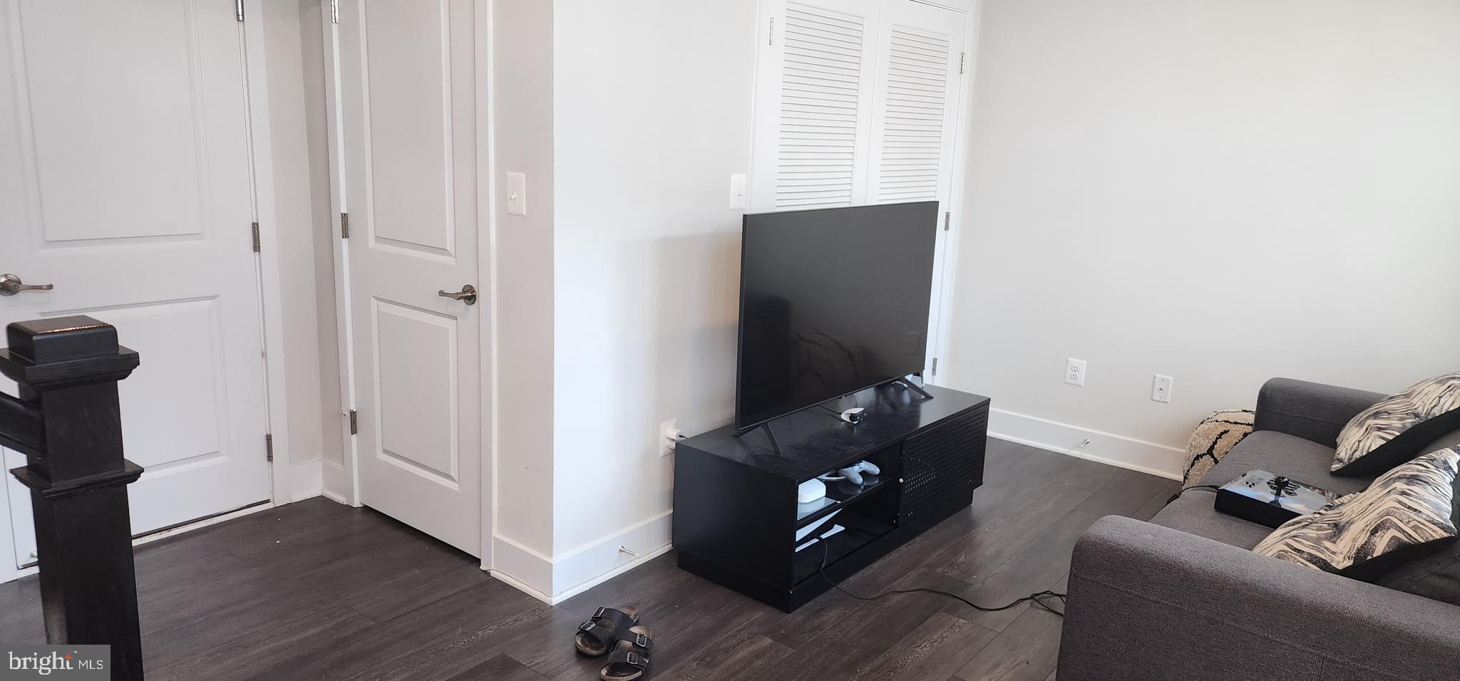 2 2nd, Unit 201 Lewes, DE 19958 - Photo 2 of 48 a living room with furniture and a flat screen tv