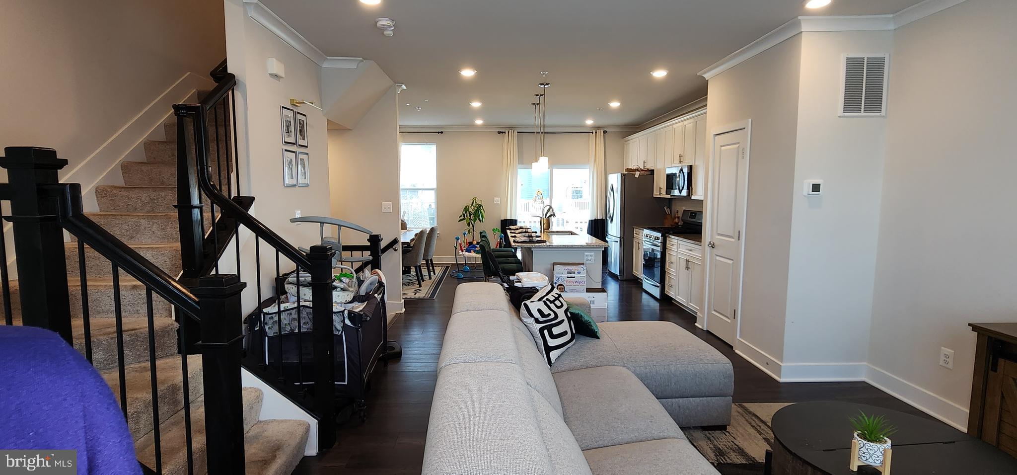 2 2nd, Unit 201 Lewes, DE 19958 - Photo 24 of 48 a living room with lots of furniture and wooden floor