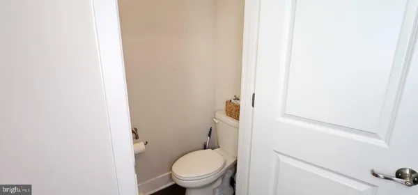 a white toilet sitting next to a white sink