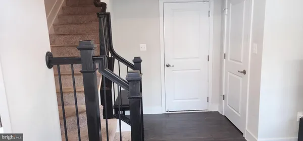 a view of an entryway with a hallway