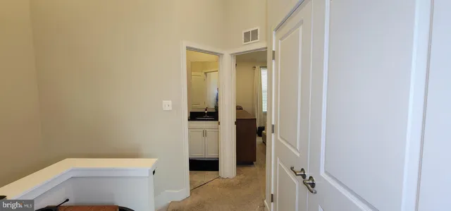 a white toilet sitting next to a bathroom sink