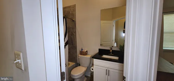 a utility room with dryer washer and a window
