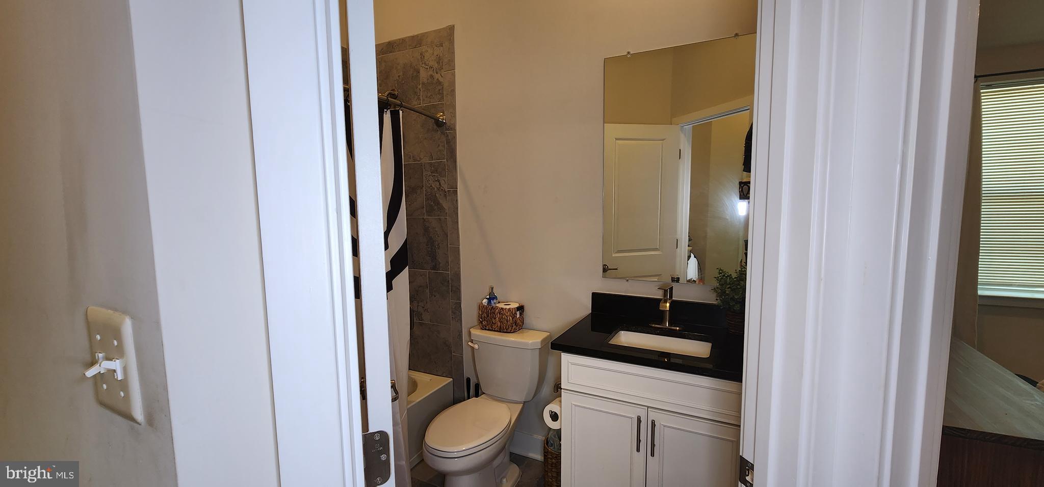 2 2nd, Unit 201 Lewes, DE 19958 - Photo 33 of 48 a white toilet sitting next to a bathroom sink