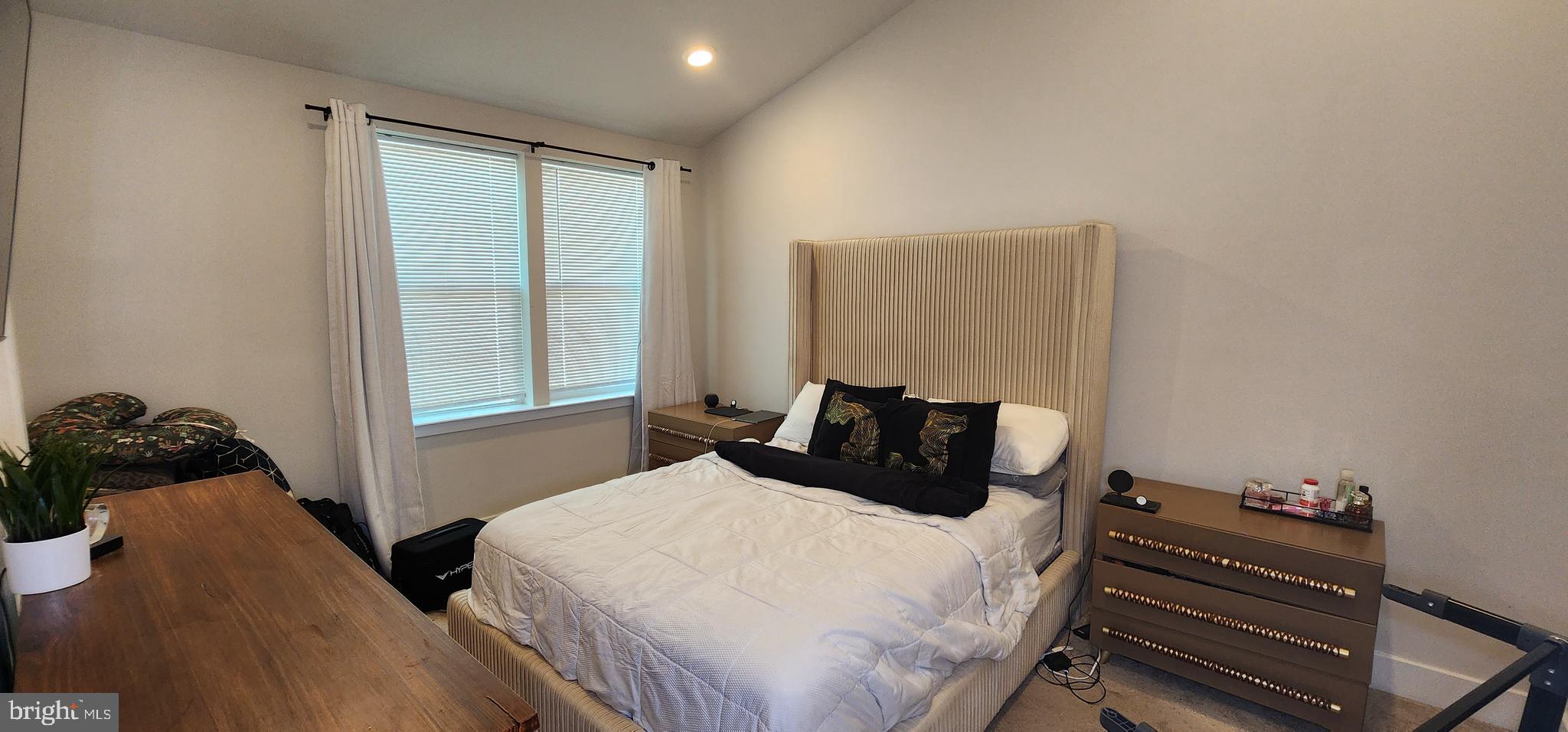 2 2nd, Unit 201 Lewes, DE 19958 - Photo 35 of 48 a bedroom with a bed and a window