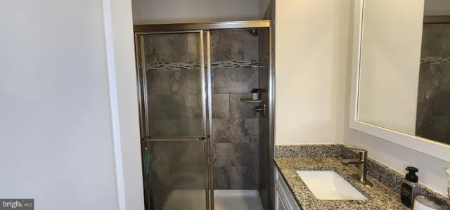 a bathroom with a shower and toilet