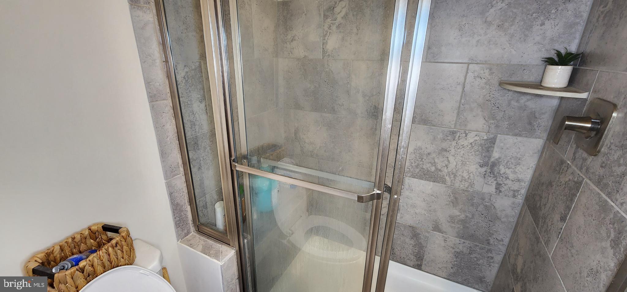 2 2nd, Unit 201 Lewes, DE 19958 - Photo 42 of 48 a bathroom with a shower and toilet