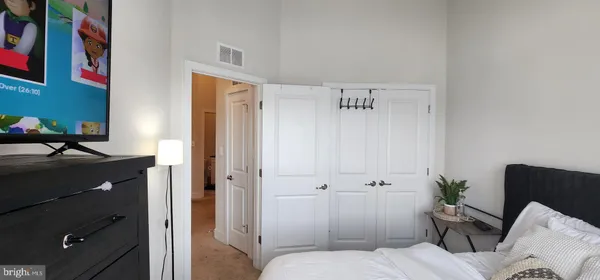 a bathroom with a toilet and a shower curtain