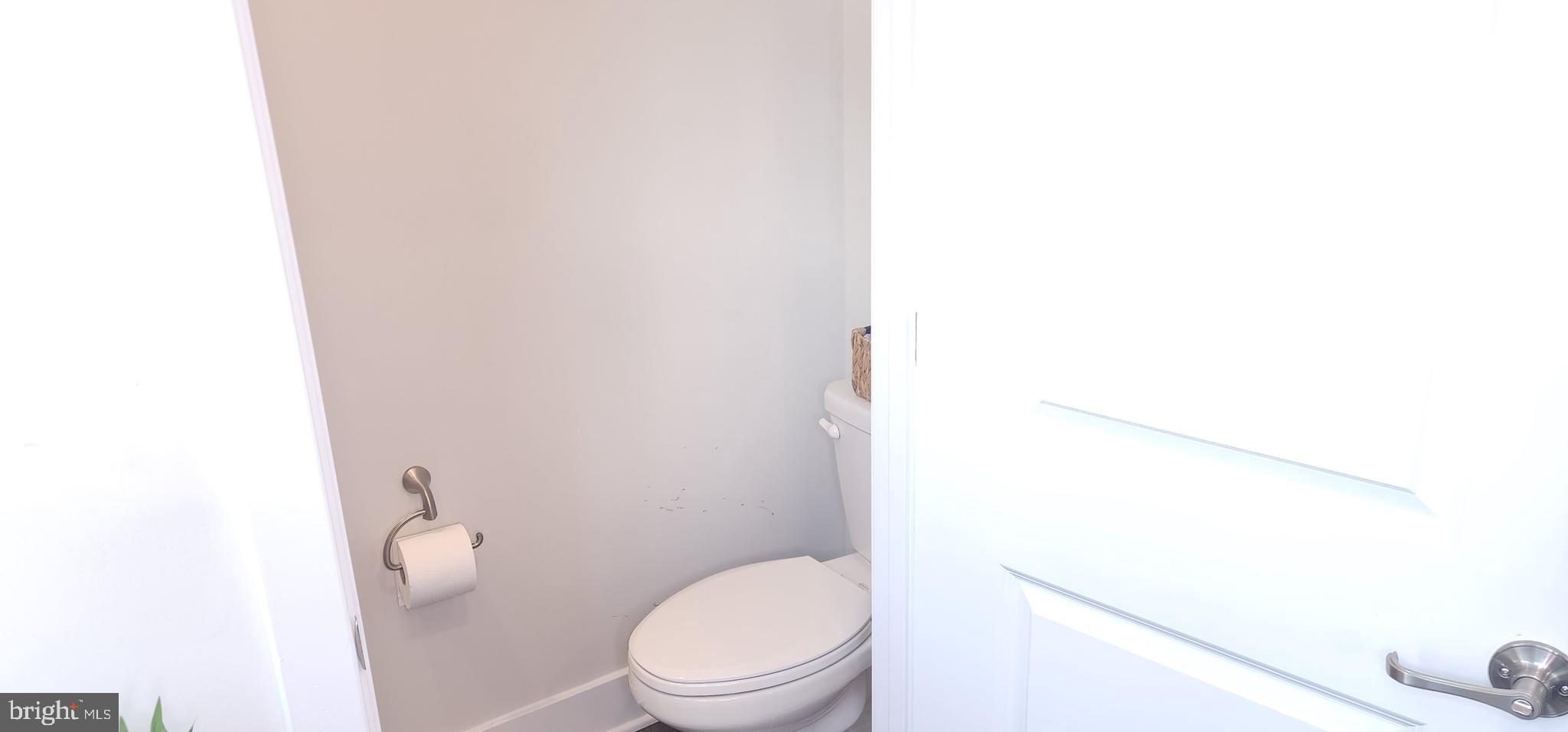 2 2nd, Unit 201 Lewes, DE 19958 - Photo 8 of 48 a white toilet sitting next to a shower