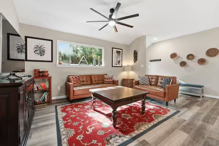 201 Winfield Thicket Road Bastrop, TX 78602 - Photo 7 of 36 a living room with furniture and a flat screen tv
