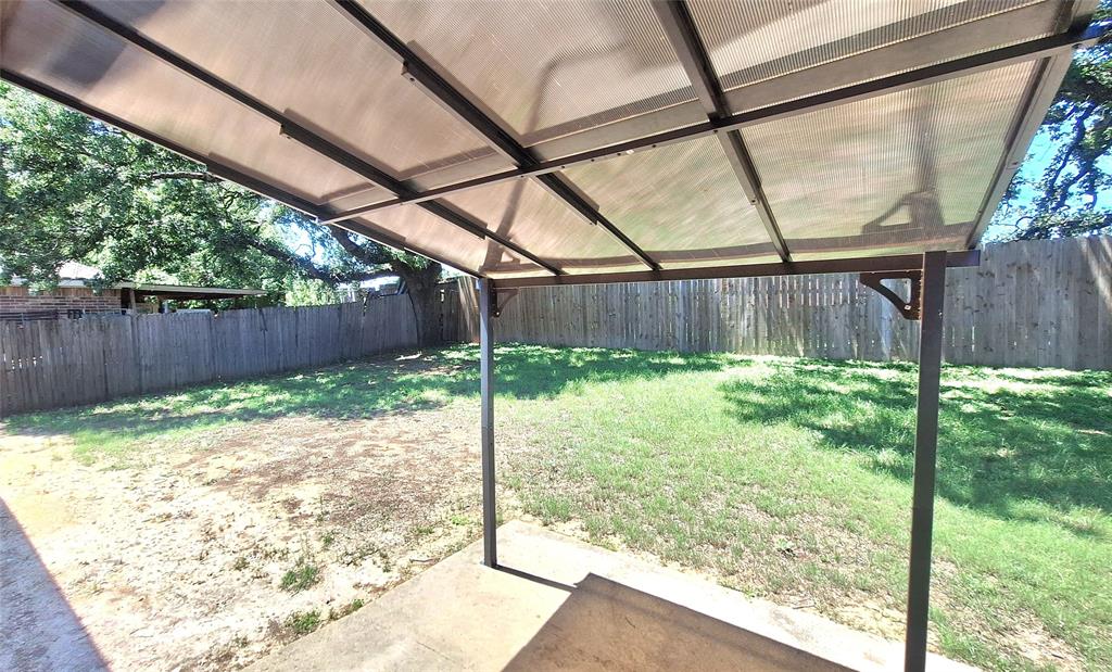 953 Hannah Way Dallas, TX 75253 - Photo 22 of 22 Covered patio area with concrete surfacing, a metal frame, and translucent panel roof