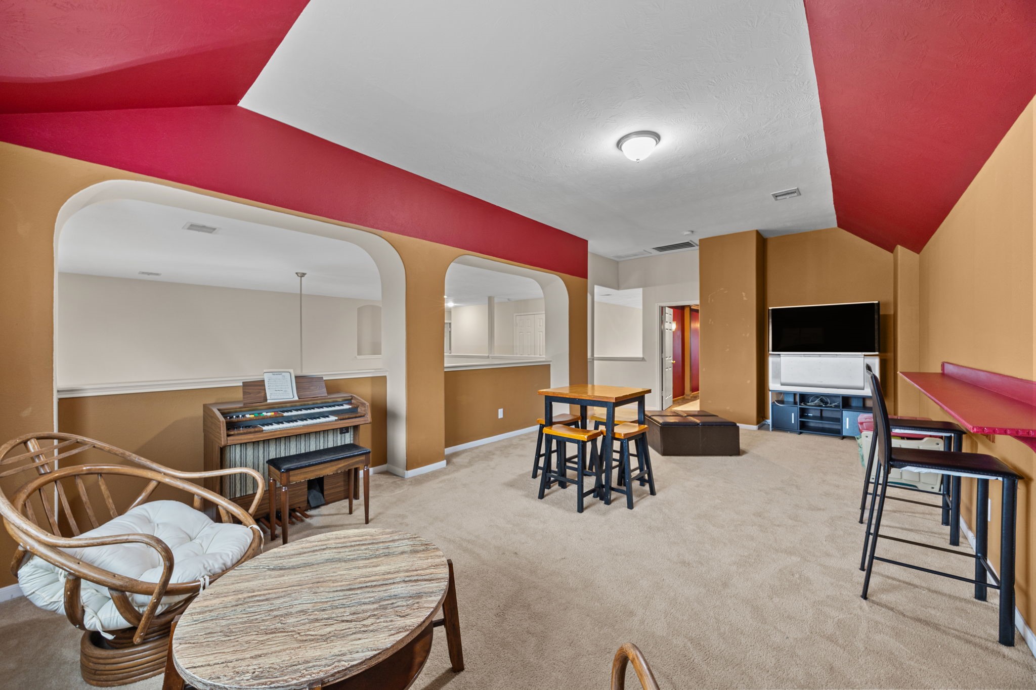 6719 Latchmore Lane Houston, TX 77049 - Photo 40 of 46 a dining room with furniture and a flat screen tv