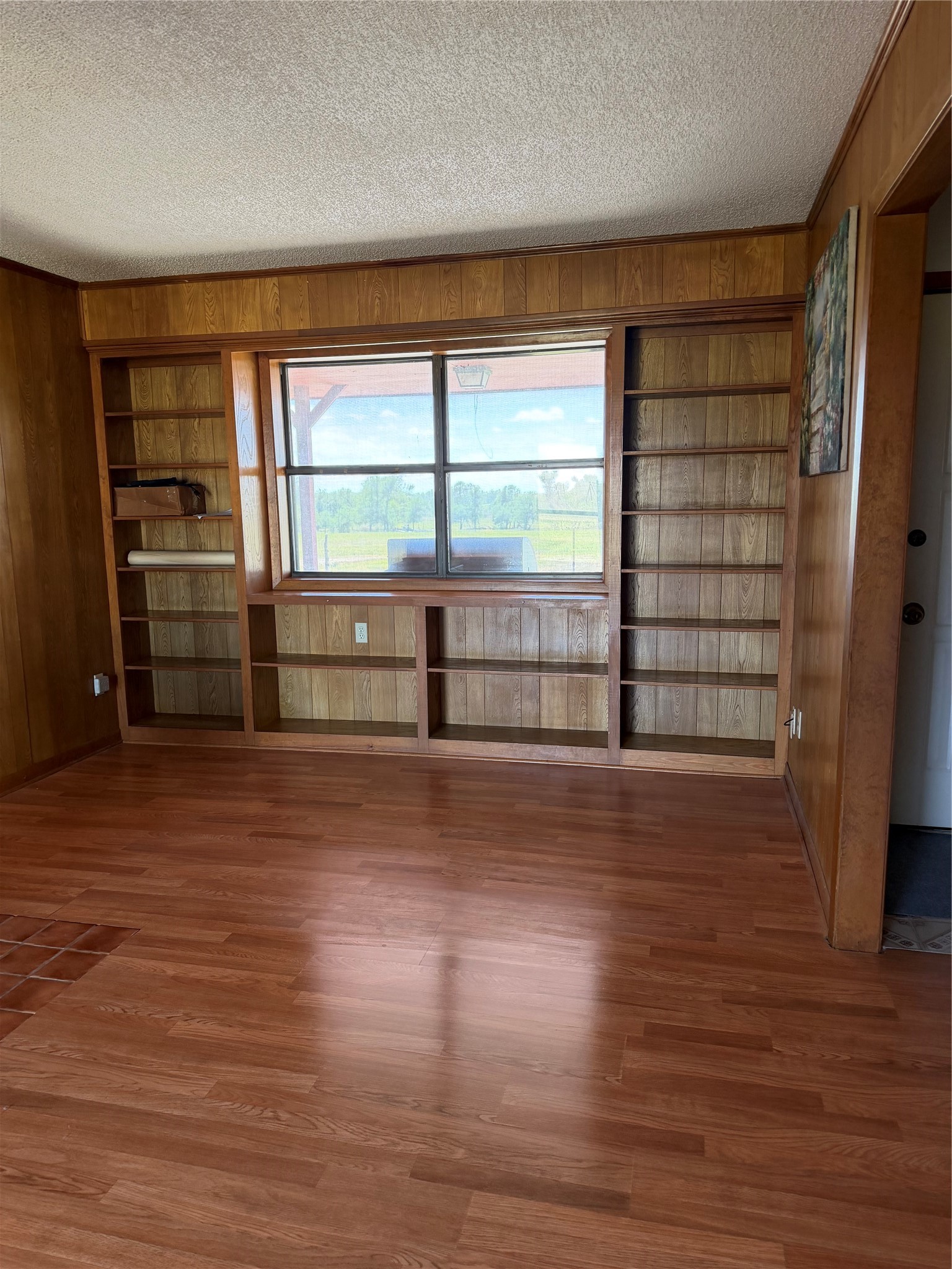 923 County Road 138 Cameron, TX 76520 - Photo 1 of 10 wooden floor in an empty room with a window