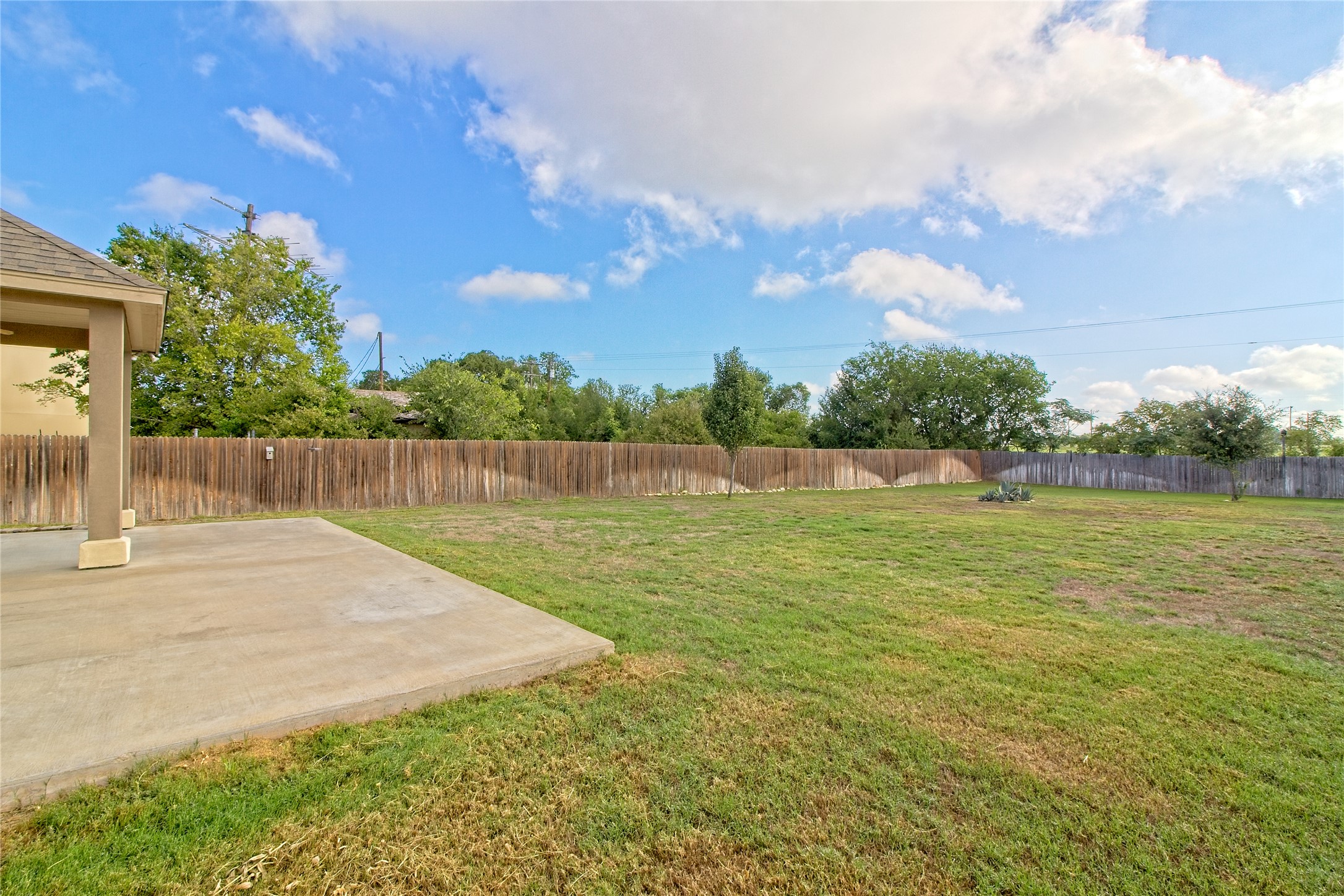 31443 Kingsway Road Georgetown, TX 78628 - Photo 29 of 40 A generously sized yard, fully fenced for privacy, ready for outdoor enjoyment.