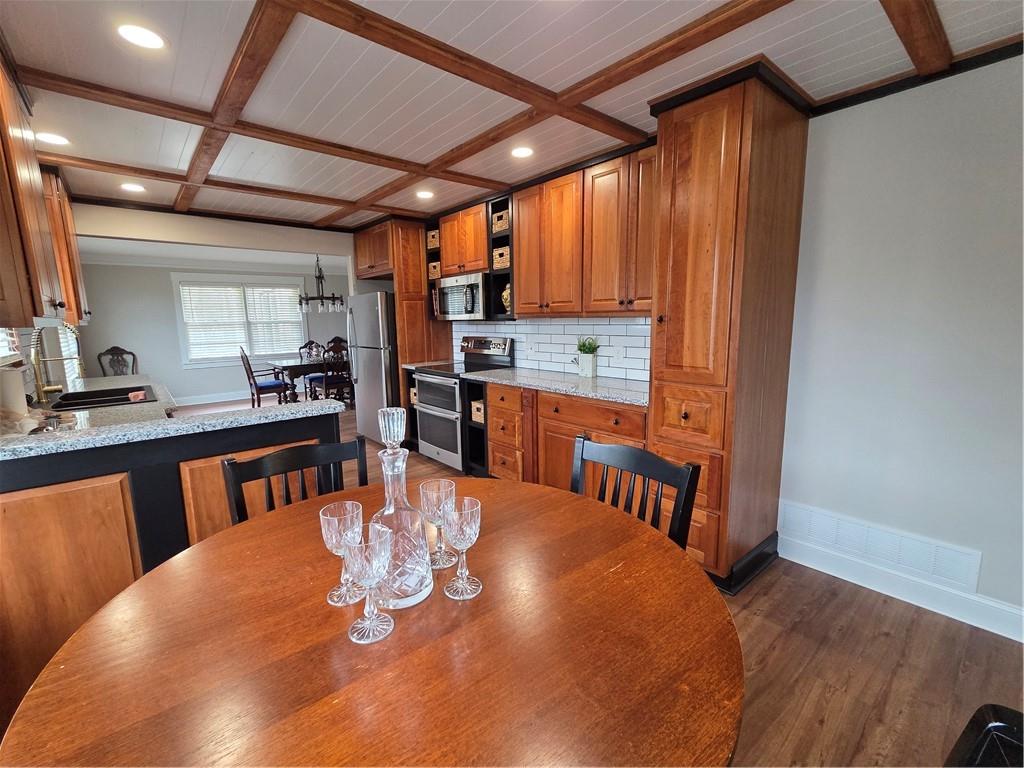 1012 Highway 332 Pendergrass, GA 30567 - Photo 16 of 51 a dining room with a wooden table and chairs