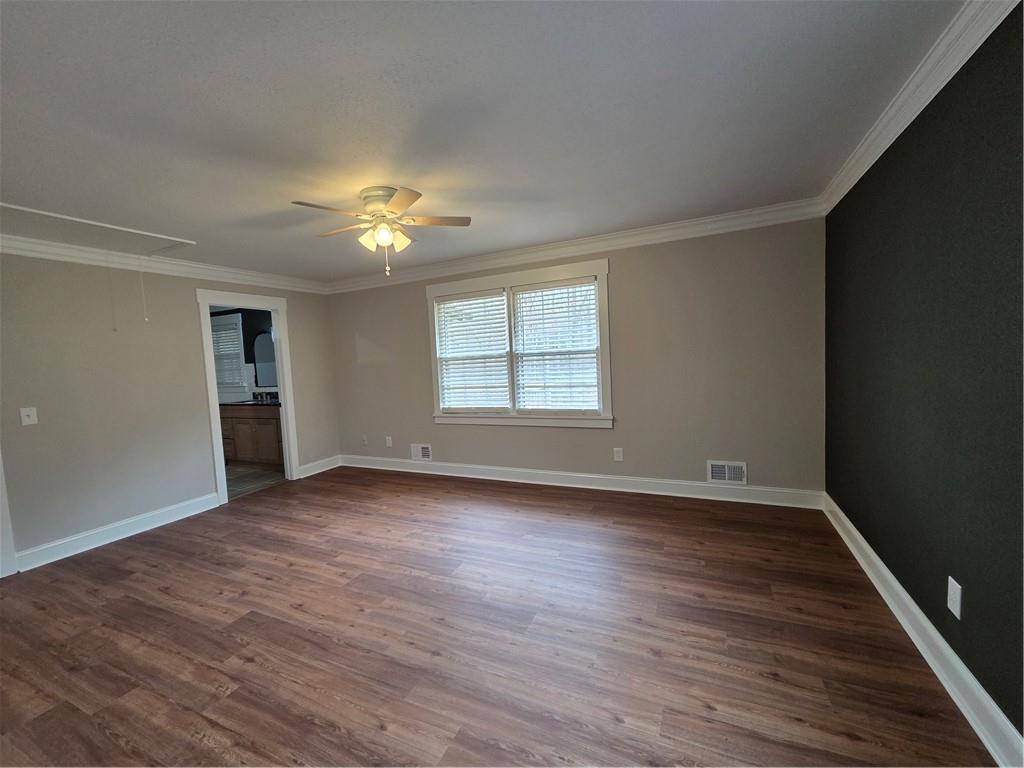 1012 Highway 332 Pendergrass, GA 30567 - Photo 28 of 51 a view of an empty room with a window and wooden floor