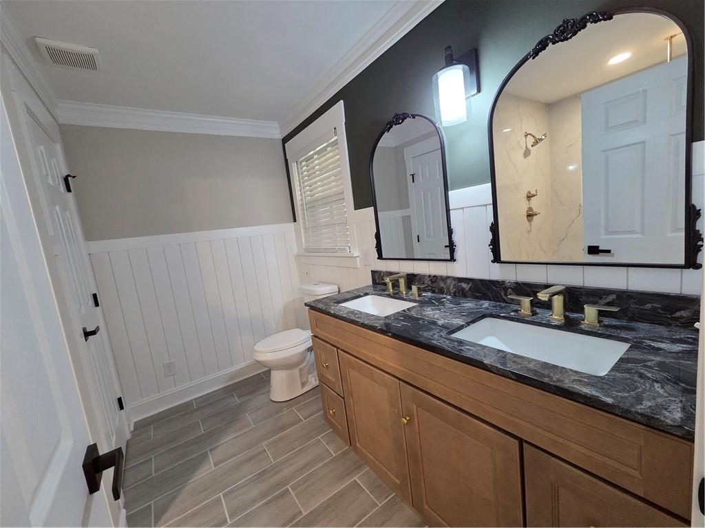 1012 Highway 332 Pendergrass, GA 30567 - Photo 32 of 51 a bathroom with a double vanity sink and a mirror