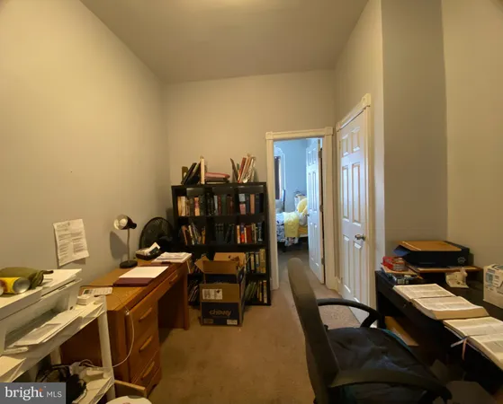a view of a workspace with furniture and lounge chair