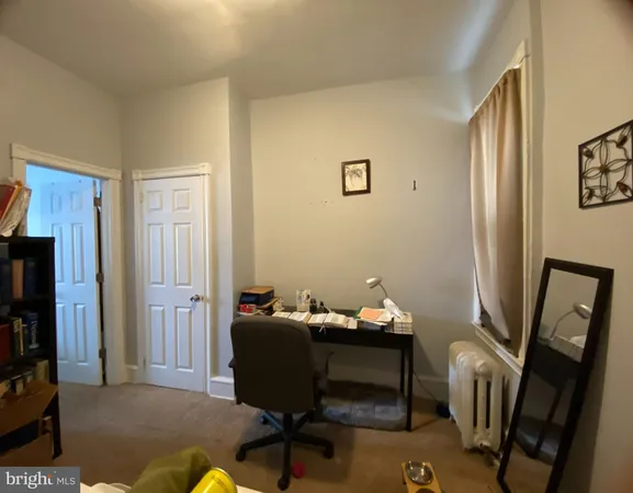 a view of a workspace with furniture and a livingroom