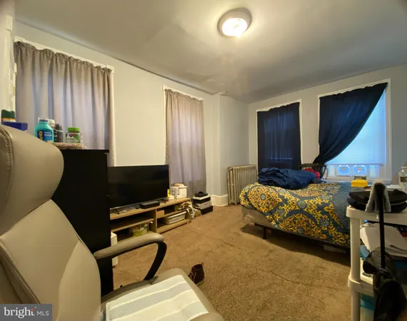 a bedroom with furniture and a projector