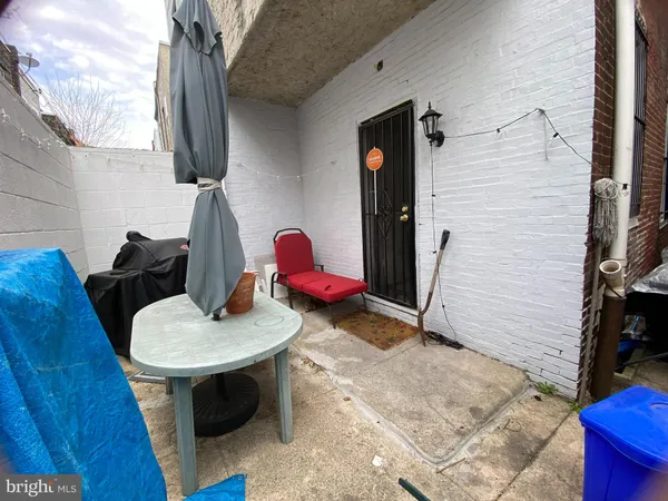a backyard of a house with seating space