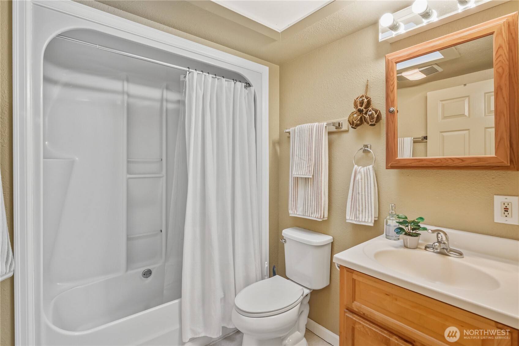 613 Hancock Street Port Townsend, WA 98368 - Photo 16 of 24 a bathroom with a sink a toilet and shower