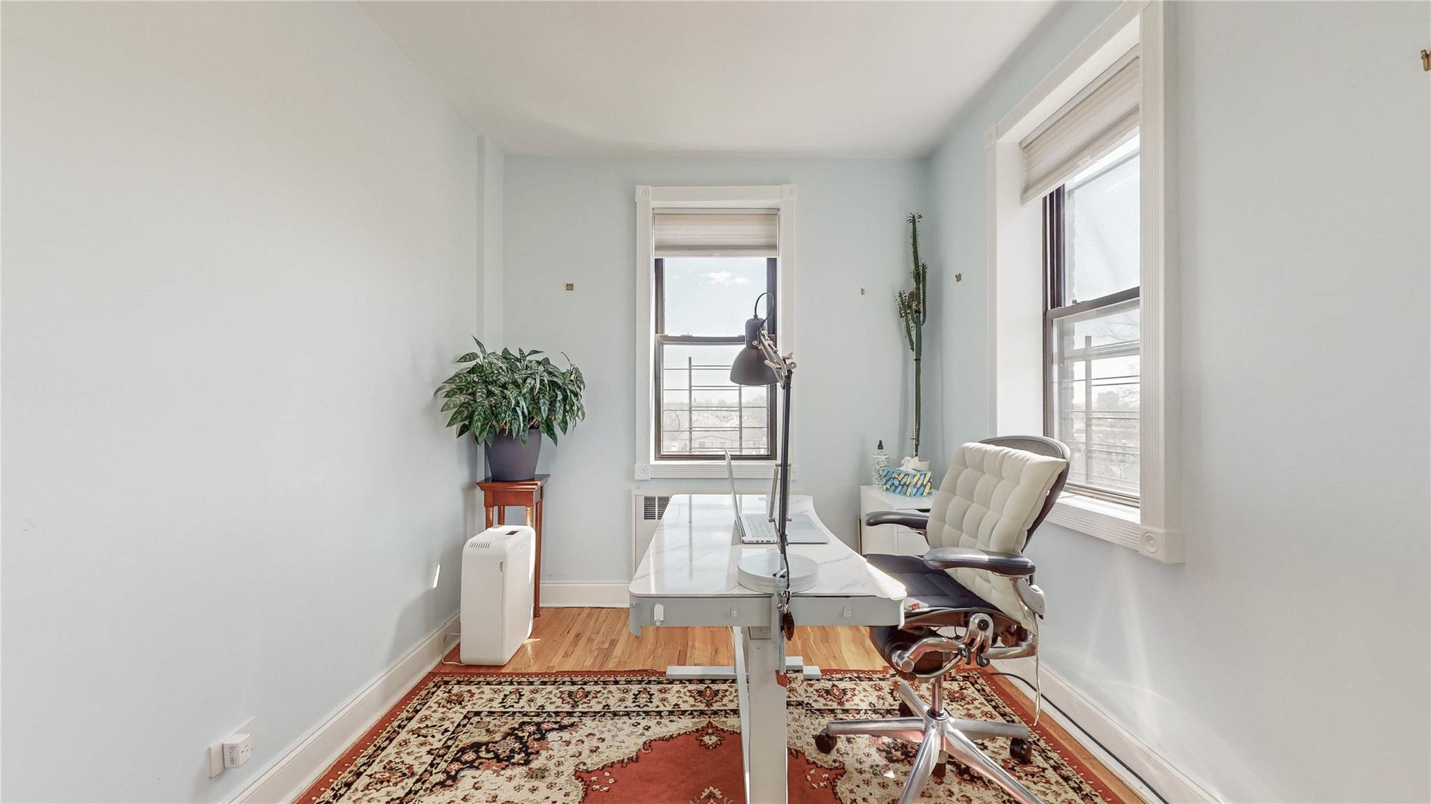 143-50 Hoover Avenue, Unit 507 Queens, NY 11435 - Photo 11 of 24 Office area with baseboards and light wood-style flooring