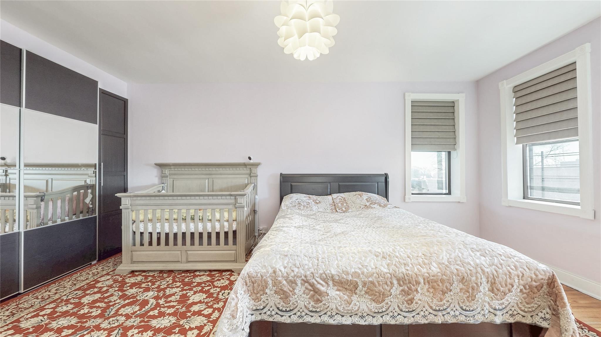 143-50 Hoover Avenue, Unit 507 Queens, NY 11435 - Photo 16 of 24 Bedroom featuring baseboards